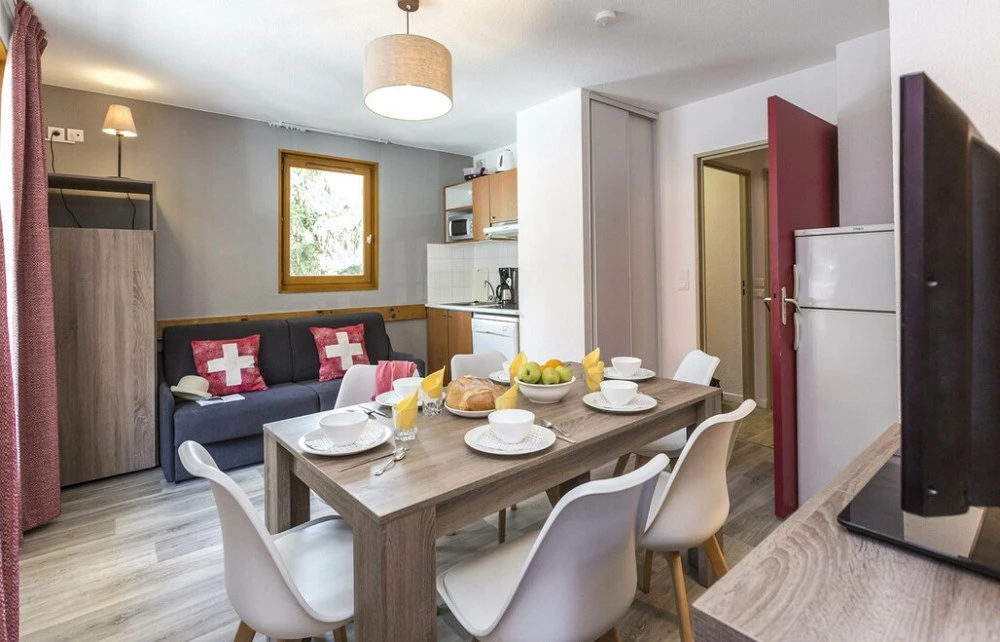 Residence Les Sybelles - woonkamer met stoelen en bank