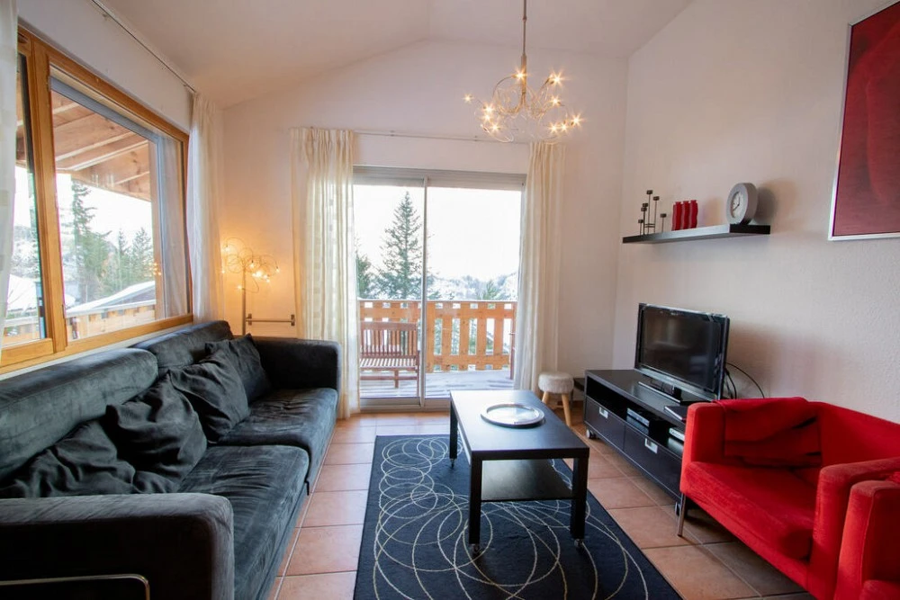Demi Chalets Le Petit Bonheur - woonkamer met balkon