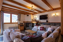 Chalet Bouquetin - woonkamer met tv en openhaard