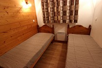 Chalet Bouquetin - slaapkamer met 2 1-persoonsbedden en verwarming